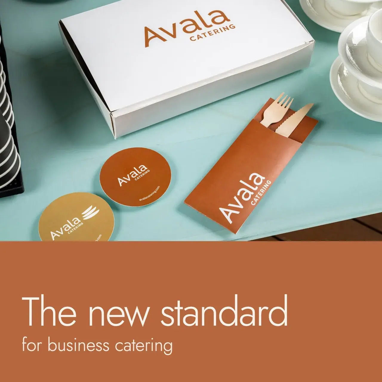 Avala Catering staff preparing a colourful salad and buffet spread for an event.